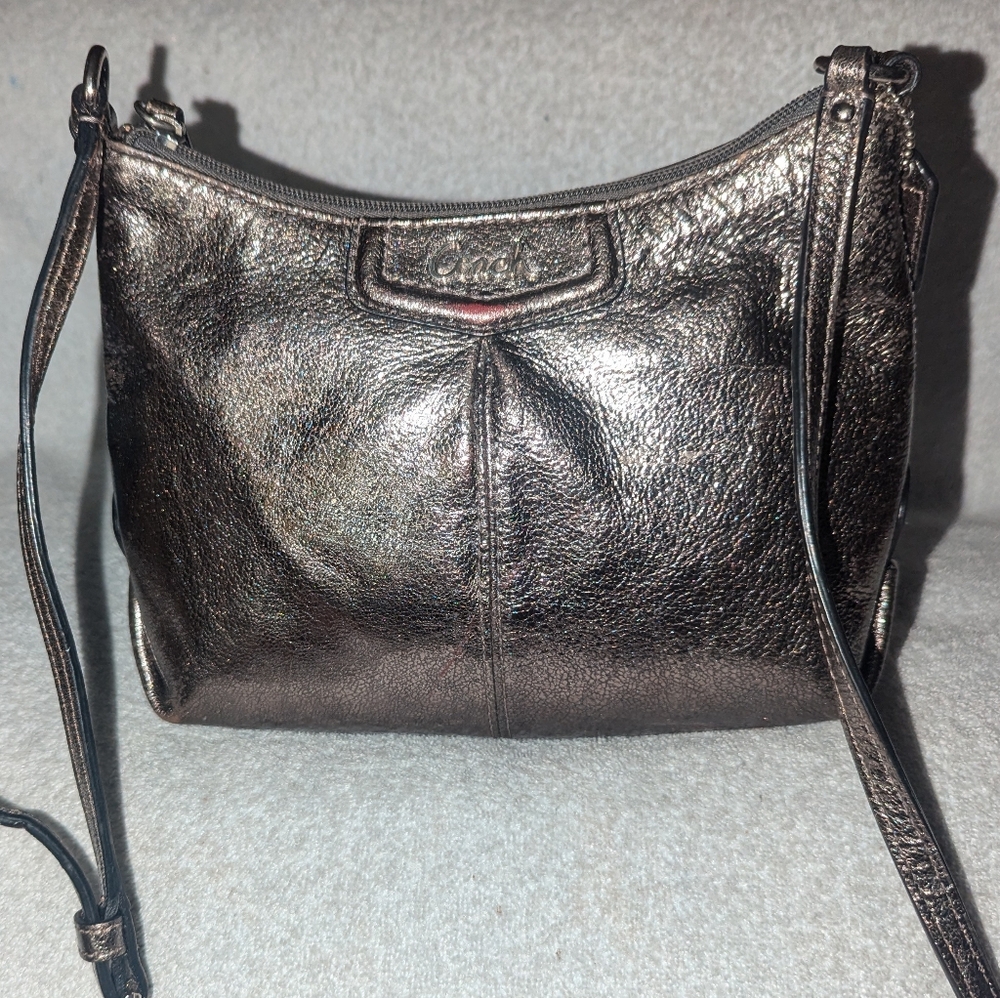 Coach Ashley silver metallic leather crossbody swingpack bag.